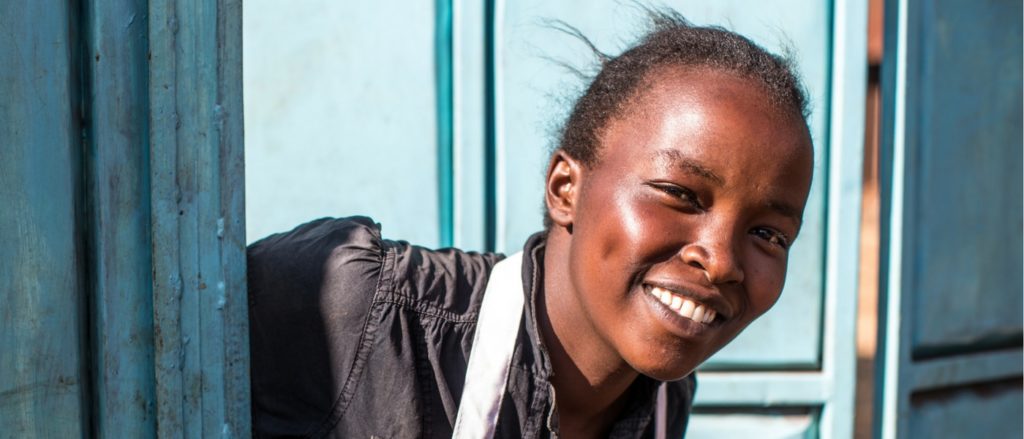 Kenyan Girl Looking out Window